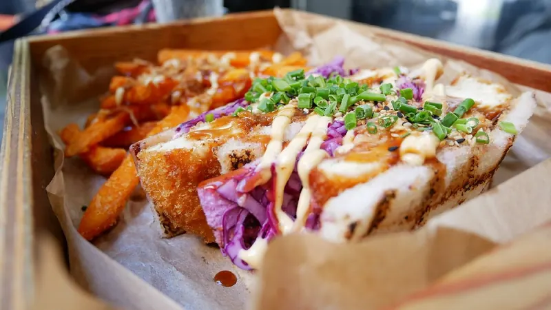 Chicken sando with coleslaw and sweet potato fries